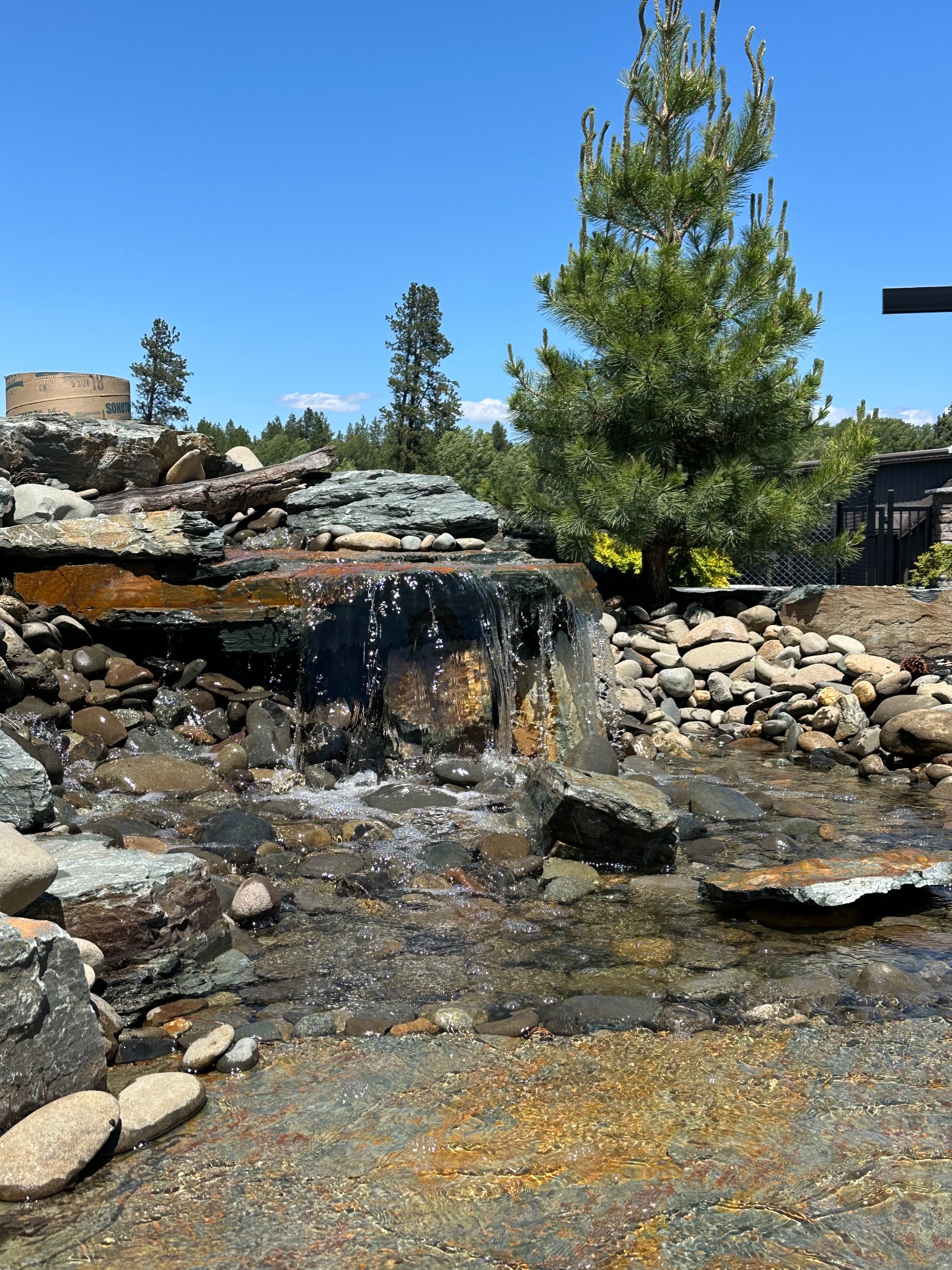 Natural waterfall by Onyx Landscape Group
